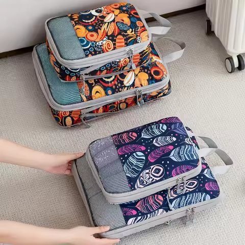 Packing cubes being loaded into an open suitcase
